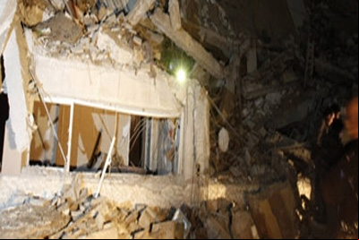 Coalizão derruba edifício Khadafi em Trípoli